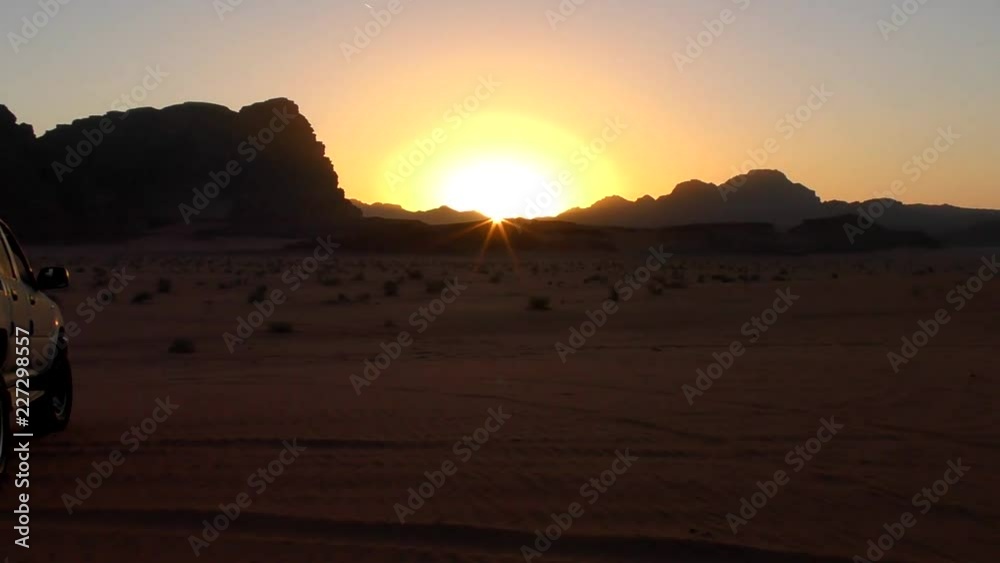 Sunset over the Wadi Rum desert in the Hashemite Kingdom of Jordan, also known as The Valley of Moon Sunset over the Wadi Rum desert in the Hashemite Kingdom of Jordan, also known as The Valley of Moon