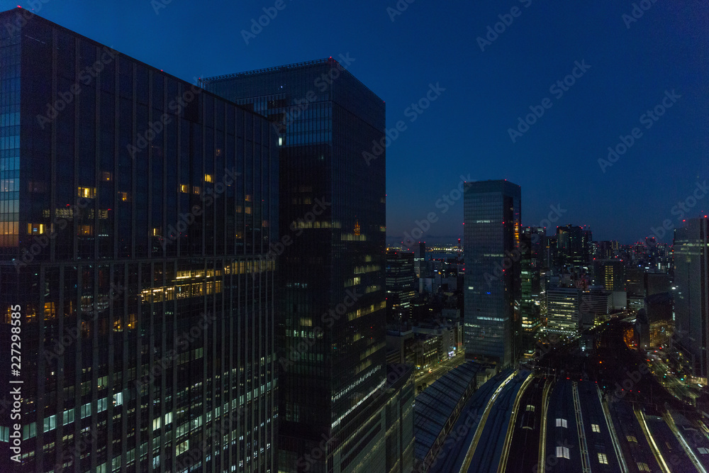 transportation and urban concept - view to tokyo city and railway station in japan at night