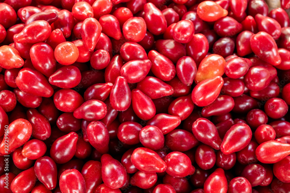 Red cornelian cherry fruits texture Red cornelian cherry fruits texture
