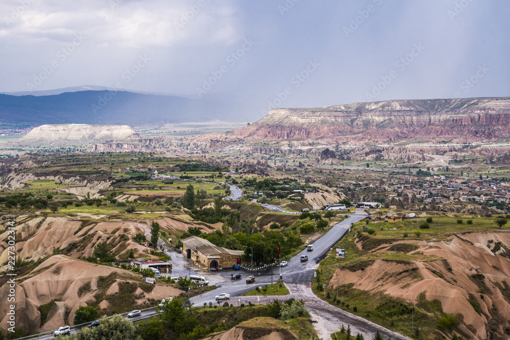 Travel Turkey - above view of Uchisar town and roads in valley in Nevsehir Province in Cappadocia in spring