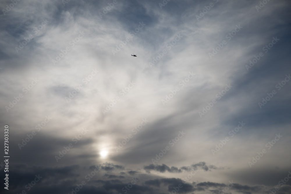 Epic Sky with Helicopter and sun