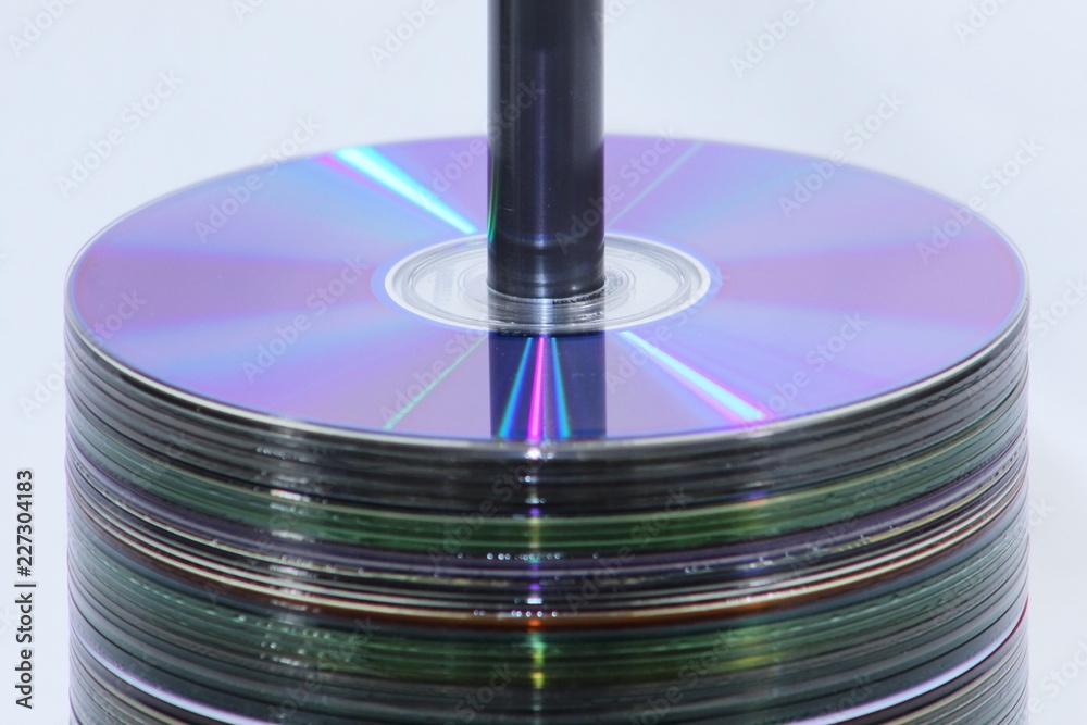 Spool of CD's stacked in the center of the frame Spool of CD's stacked in the center of the frame