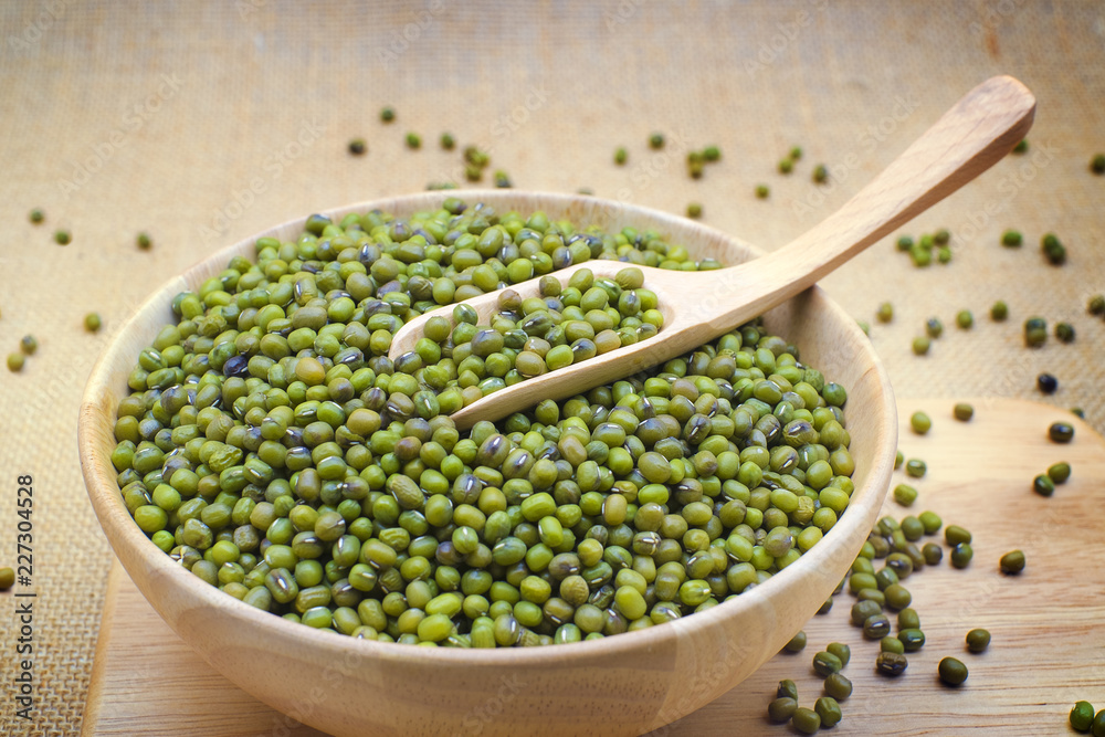 Green bean or mung bean in bowl and sack background. Green bean or mung bean in bowl and sack background.