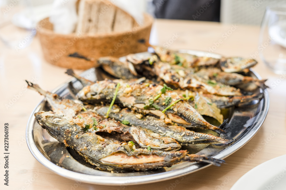 Silver tray full of delicious fish mackerel known as carapau in Portugal Silver tray full of delicious fish mackerel known as carapau in Portugal