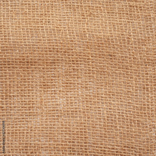 burlap woven texture pattern background in yellow beige cream brown color, copyspace . One thousand one hundred eleven