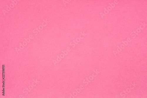 pink paper texture background. colored cardboard fibers and grain. empty space concept.