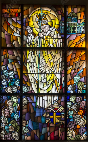 Chełm, Poland, 10 September 2018: Stained glass window with the image of Saint Pope John Paul II in the window of the church, the shrine of Our Lady in Chełm photo