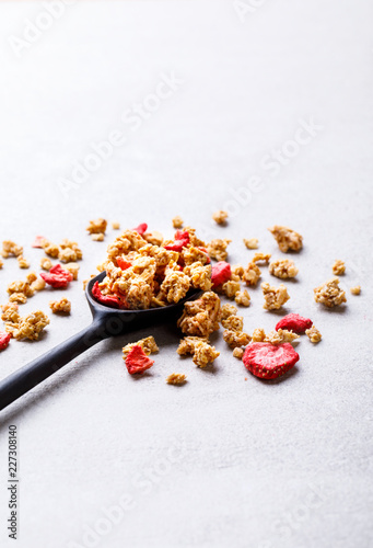 Photos Granola Cereal bar with Strawberries in a spoonful Background
