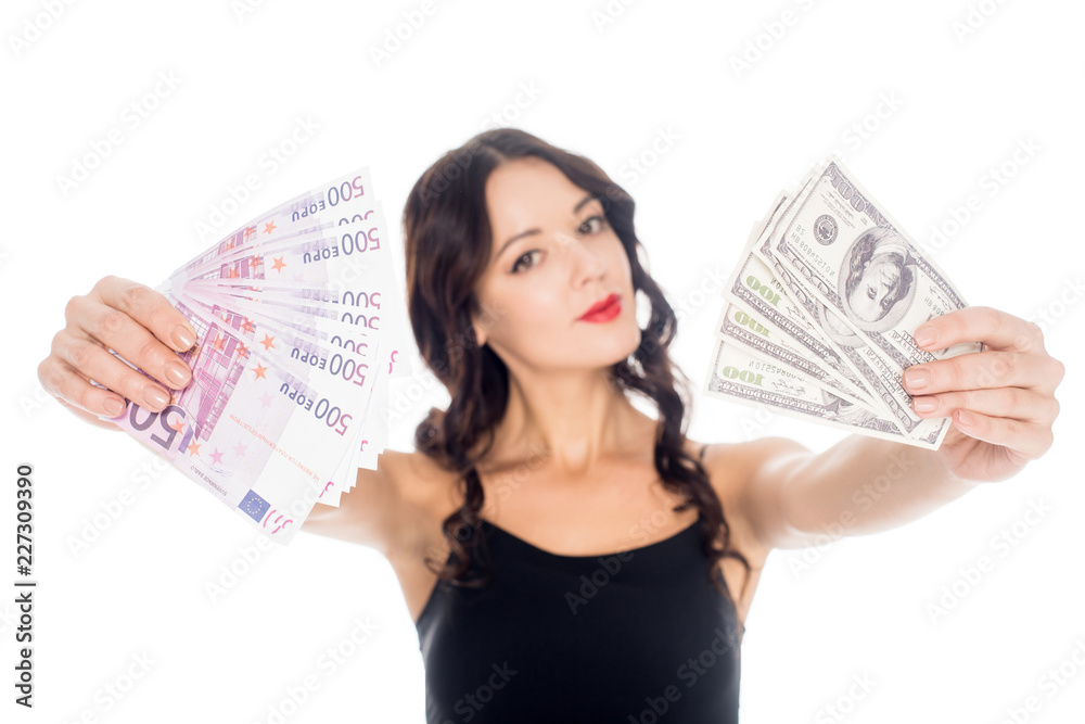 portrait of young woman showing dollar and euro banknotes in hands isolated on white portrait of young woman showing dollar and euro banknotes in hands isolated on white