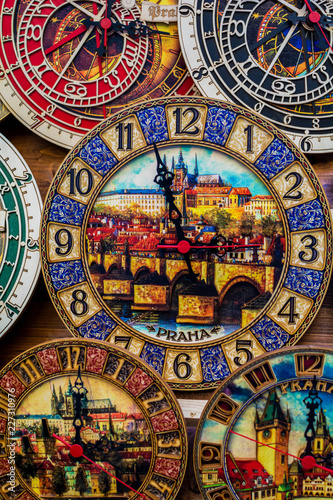 Vibrant multi colored wooden clock. Paint about Prague inside of Clock. One Two Three Four Five Six Seven Eight Nine Ten.