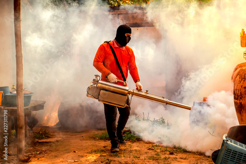 Fumigation mosquitoes enter houses made of wood kill mosquito carrier of dengue virus.Soft and blur focus. photo