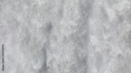 Wallpaper Mural Powerful raging whitewater waterfall falling forcefully over a rocky edge. Crystal clear glacier water stream dropping over the cliff Torontodigital.ca