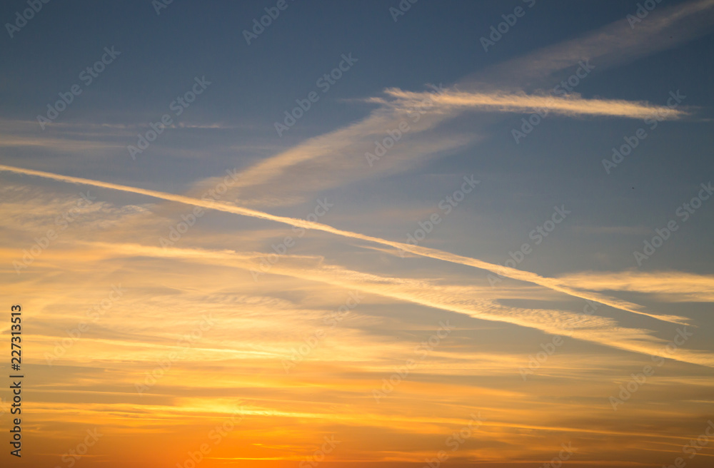 Beautiful panorama of the evening blue sky with colored clouds