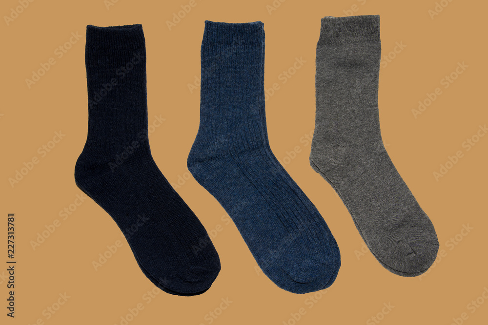 Three pairs of warm socks on brown background Three pairs of warm socks on brown background