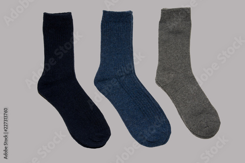 Three socks on light grey background