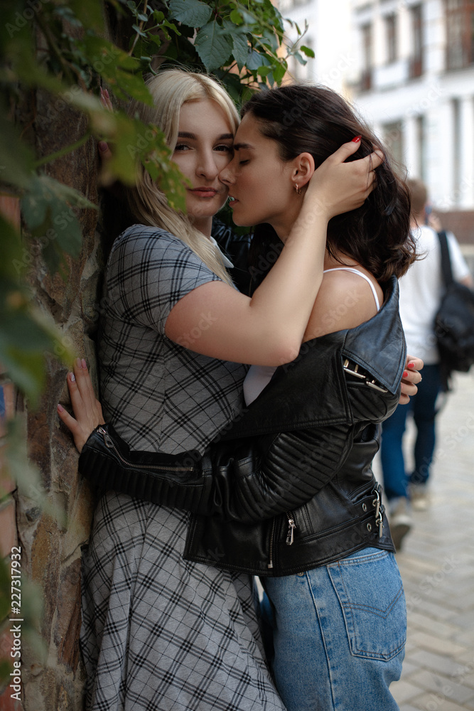 Kissing Lesbian Girls Embracing Each Other Expressing Their Feeling Wearing Fashion Clothes