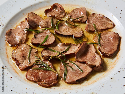 Fried beef tongue with coarse salt. Grilled beef tongue. photo