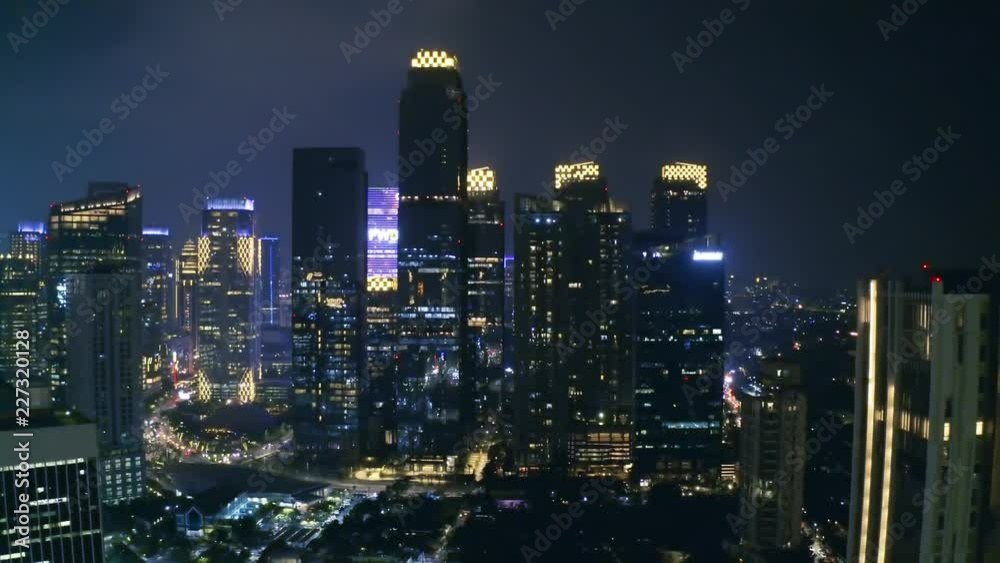 JAKARTA, Indonesia - October 10, 2018: Beautiful aerial scenery of modern skyscrapers in Sudirman Central Business District at night. Shot in 4k resolution JAKARTA, Indonesia - October 10, 2018: Beautiful aerial scenery of modern skyscrapers in Sudirman Central Business District at night. Shot in 4k resolution