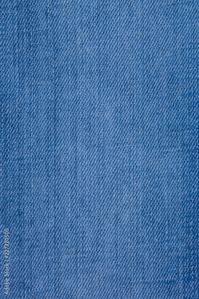 Jeans material with a rough texture blue color. Jeans material with a rough texture blue color.