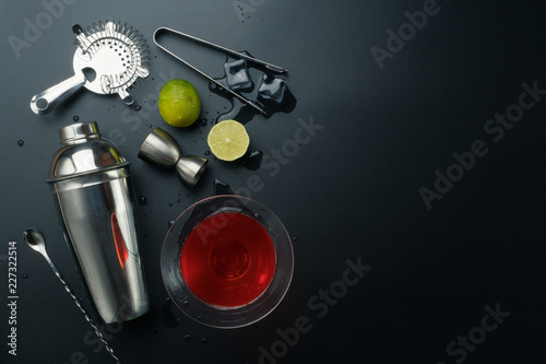 Cuadro en lienzo Cosmopolitan cocktail and bar equipments, stainless steel cocktail shaker and ji
