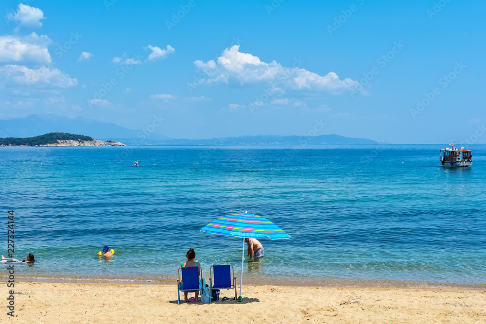 Fototapeta premium Olympiada, Greece - August 18, 2018: Beach of Olimpiada town at Chalkidiki, Greece