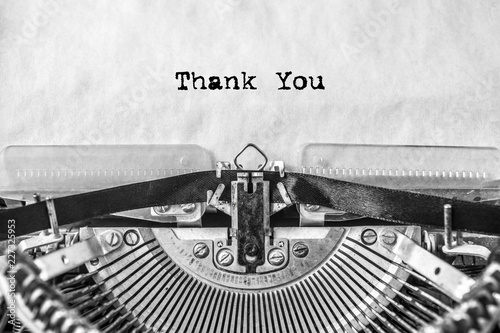 thank you, the text is typed on a vintage typewriter, in black ink on old paper. close-up