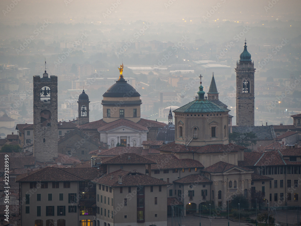 Bergamo. One of the beautiful city in Italy. Morning landscape at the old town from Saint Vigilio hill during fall season Bergamo. One of the beautiful city in Italy. Morning landscape at the old town from Saint Vigilio hill during fall season