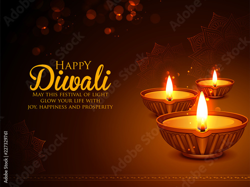Burning diya on happy Diwali Holiday background for light festival of India
