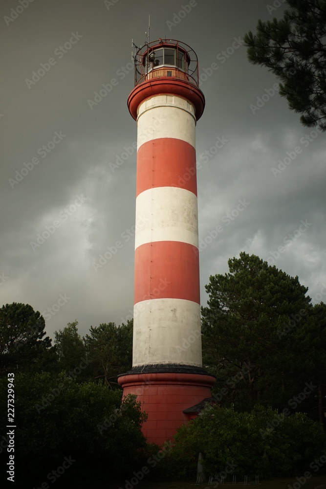 Lighthouse in Nida, Lithuania. Nida Lighthouse is located in Nida, on the Curonian Spit in between the Curonian Lagoon and the Baltic Sea. lighthouse in Nida was constructed in the 1860s and 1870s. Lighthouse in Nida, Lithuania. Nida Lighthouse is located in Nida, on the Curonian Spit in between the Curonian Lagoon and the Baltic Sea. lighthouse in Nida was constructed in the 1860s and 1870s.