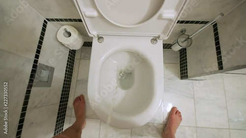 Flushing the toilet after pee photo