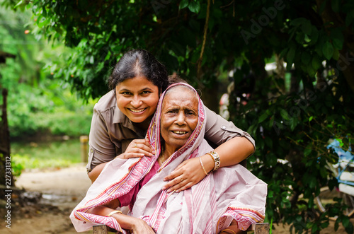 Young Woman helping Old Woman