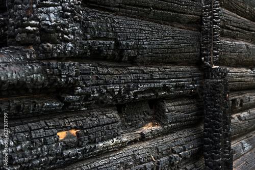 Wooden wall covered in ash
