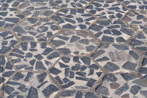 Construction Materials. Covering the roadway with pentagons of concrete and granite