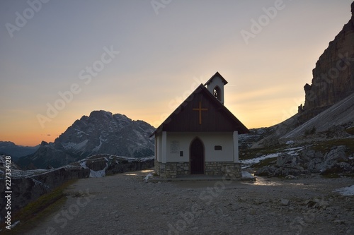 Church at sunset in the mountains tre cime di lavaredo, Italy, Dolomites