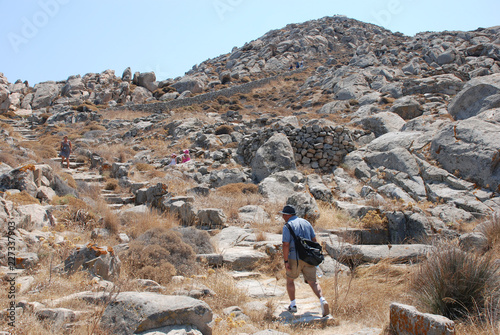 hiker in the mountains - tourism in delos, greece