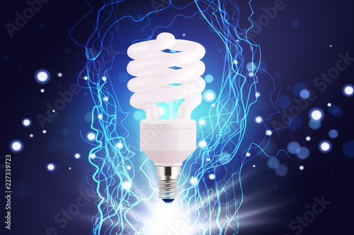 Eco energy saving light bulb, glowing compact fluorescent lightbulb. Energy saving digital design concept of blue glowing neon flasf lights. Eco energy banner. photo