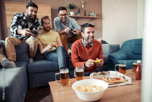 Male friends playing video games