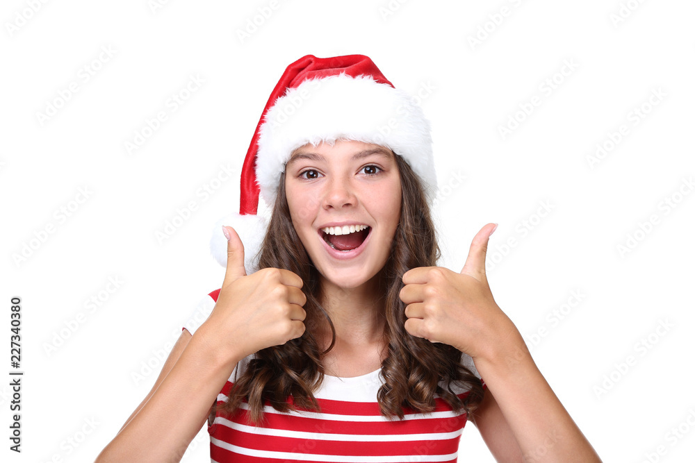 Emotional girl in santa hat isolated on white background Emotional girl in santa hat isolated on white background