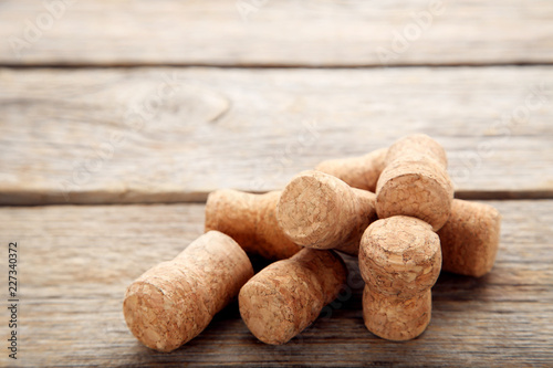 Champagne corks on grey wooden table