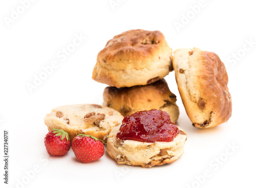 Obraz na plátne Traditional  scones with fresh strawberries and jam isolated on white