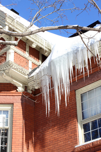 Icicles Hanging From An Ice Dam On An Old House Canada