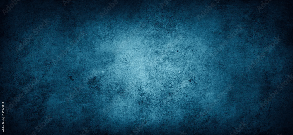 Grunge dark blue textured stone wall background