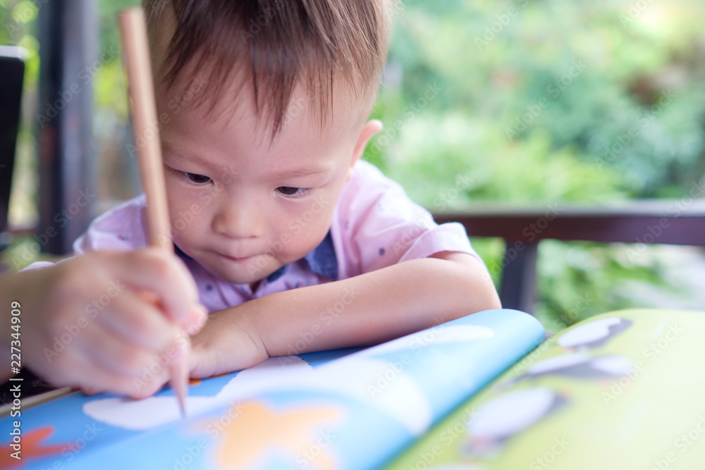 Cute Asian 2 years old toddler boy writing / drawing with pencil, Preschooler doing homework, Creative play for toddler, Little kid prepare for preschool admission test, improve focus in child concept Cute Asian 2 years old toddler boy writing / drawing with pencil, Preschooler doing homework, Creative play for toddler, Little kid prepare for preschool admission test, improve focus in child concept