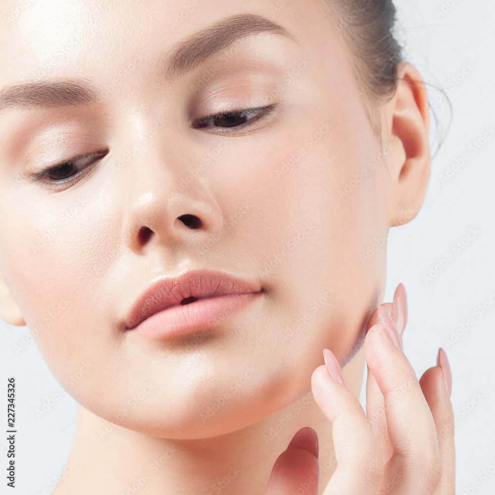 Fototapeta premium Young beautiful woman with clean perfect skin close-up