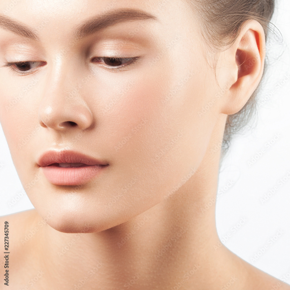Young beautiful woman with clean perfect skin close-up Young beautiful woman with clean perfect skin close-up