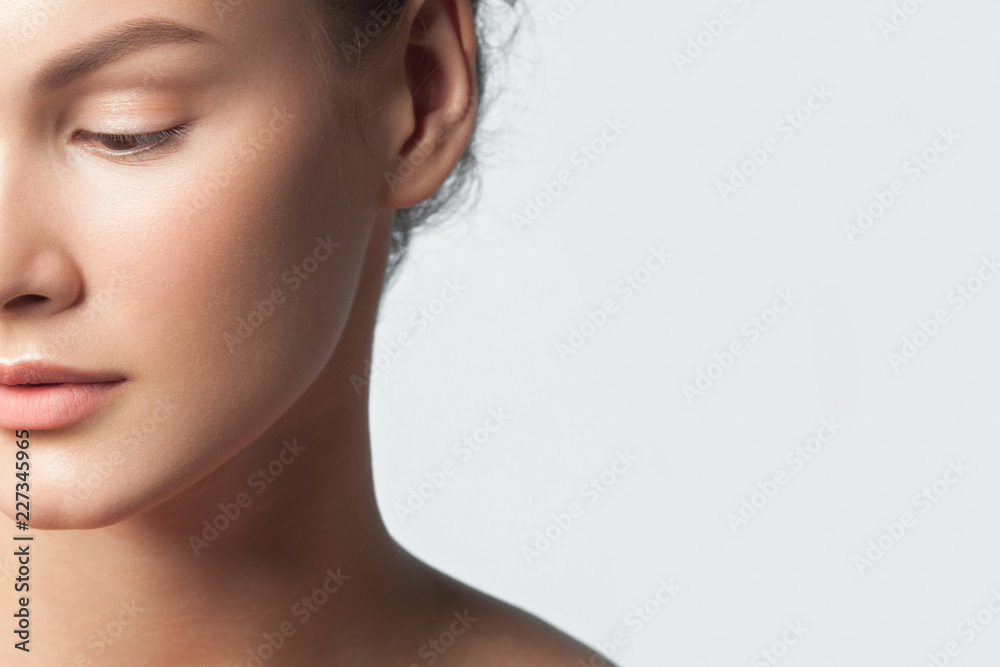 Fototapeta premium Young beautiful woman with clean perfect skin close-up