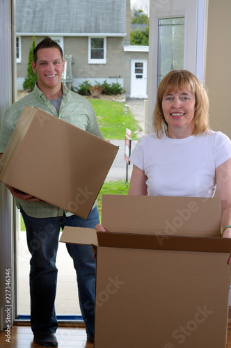 Mom Helping To Move House With Grown Children photo