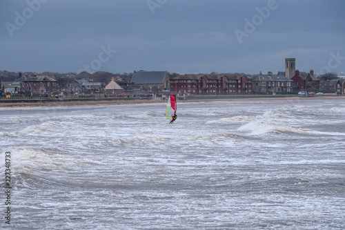 Stormy Saltcaots Bay in Scotland and a Single Loan Wind Surfer. photo