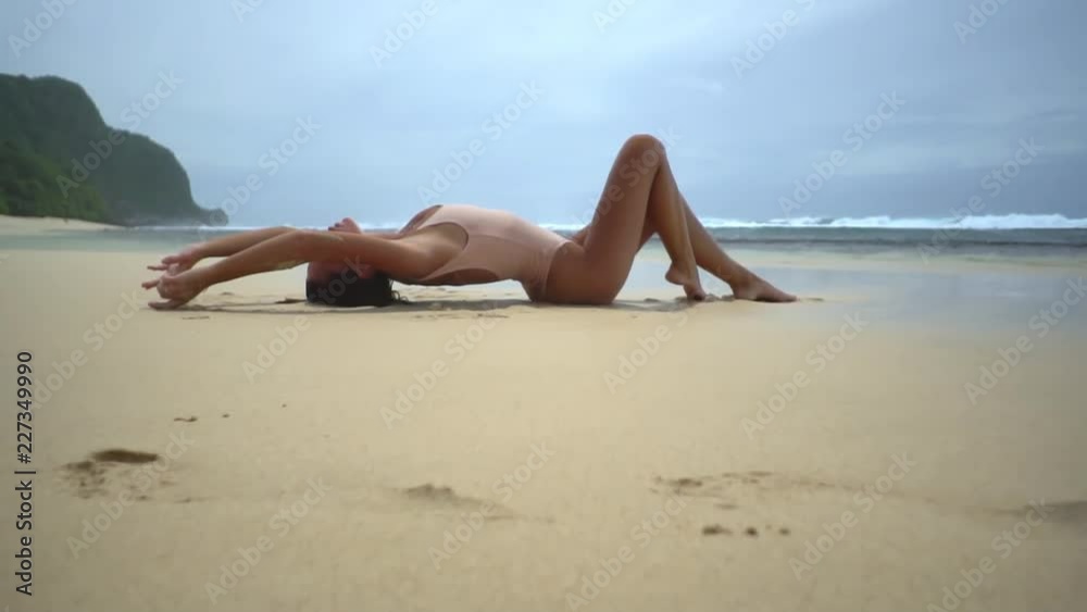 Brunette woman on sendy beach in sweemware Brunette woman on sendy beach in sweemware