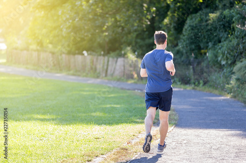 Man running at the park in New York City, USA, daily routine and fitness concept